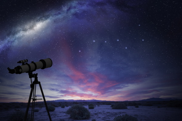 Telescope with Milky Way constellation